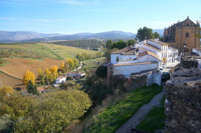 High angle view of houses and trees against sky