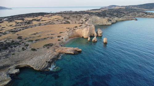 High angle view of rocks on beach against sky