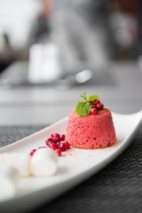 Close-up of red currant molten cake served in tray on table