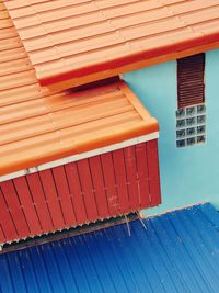 Tilt image of building against blue sky