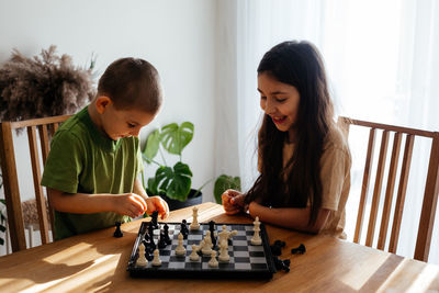 Boys playing on table