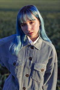 Portrait of woman standing outdoors