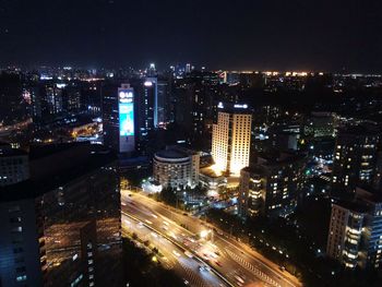 High angle view of illuminated buildings in city at night