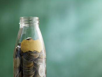 Close-up of coins in jar