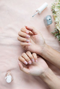 Directly above shot of woman holding hands