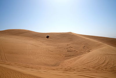 Scenic view of desert against clear sky