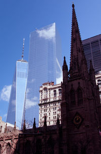 Low angle view of buildings against blue sky