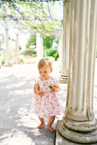 Full length of cute girl standing outdoors