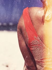 Cropped image of woman at beach