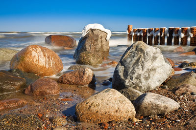 Rocks at shore during winter