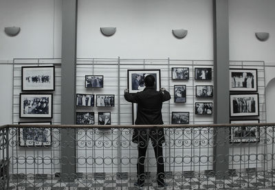 Rear view of man photographing