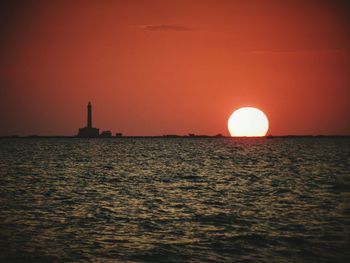 Scenic view of sea at sunset