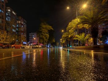 Wet city street at night