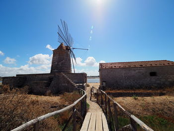 Traditional windmill against sky