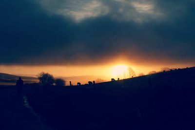 Scenic view of silhouette landscape against sky during sunset