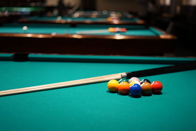 Cropped hand playing pool