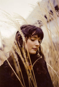 Close-up of young woman looking down