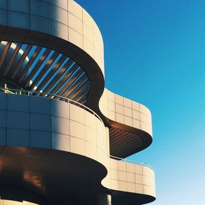 Low angle view of tower against blue sky