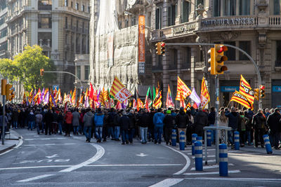 People walking on street in city on manifistation