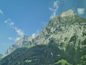 Low angle view of rock formation against sky