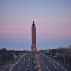 Empty road leading towards water tower at jones beach state park