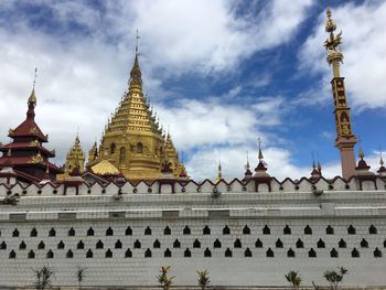 Low angle view of temple against building