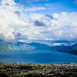 Scenic view of mountains against cloudy sky