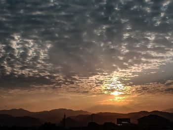 Scenic view of dramatic sky during sunset