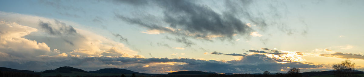 Panoramic view of silhouette mountains against sky during sunset