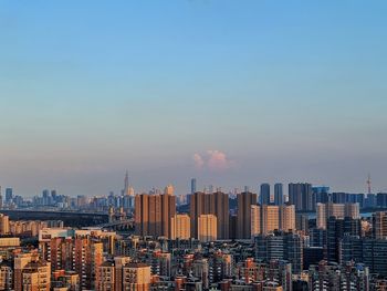 Cityscape against sky during sunset