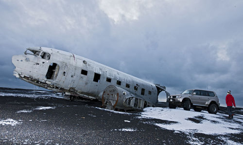 Woman exploring famous plane wreck in iceland
