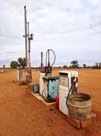 Rusty metallic structure on desert against sky