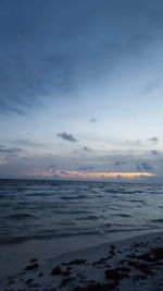 Scenic view of sea against sky at sunset