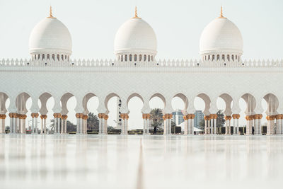 View of mosque against sky in city