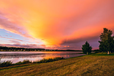 Scenic view of lake against sky during sunset