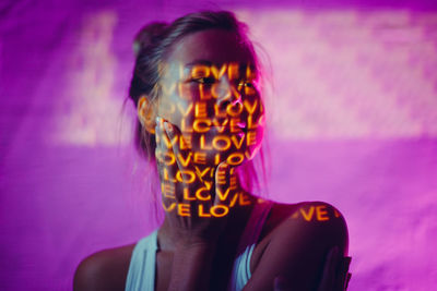 Portrait of young man with illuminated text