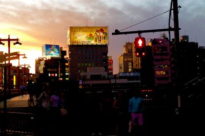 View of illuminated city at sunset