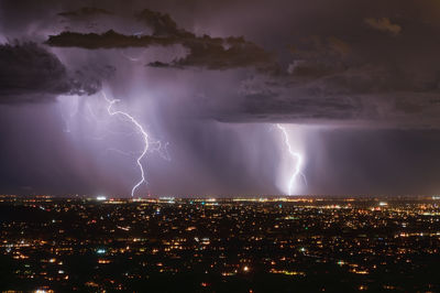 Lightning storm over tucson, arizona during monsoon season. nighttime picture.