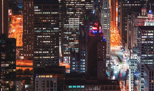 Illuminated buildings in city at night