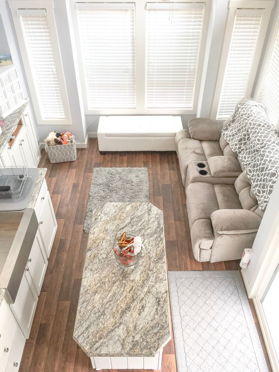 HIGH ANGLE VIEW OF SOFA ON TABLE IN HOUSE