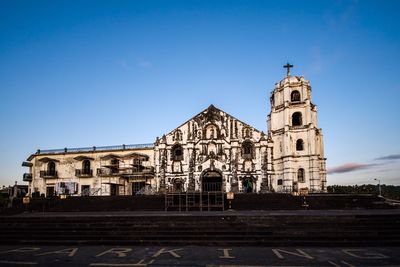 Low angle view of church against clear blue sky