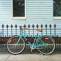 Bicycle parked against wall