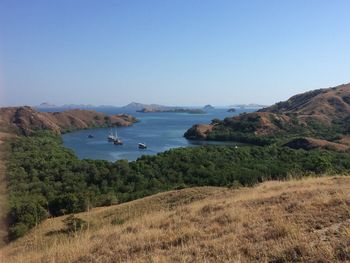 Scenic view of bay against clear sky