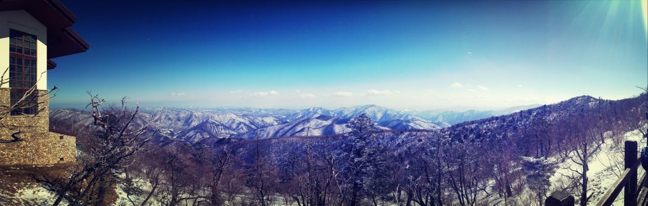 snow, mountain, winter, cold temperature, landscape, building exterior, built structure, sky, scenics, architecture, blue, tranquil scene, tranquility, beauty in nature, nature, mountain range, house, panoramic, clear sky, weather