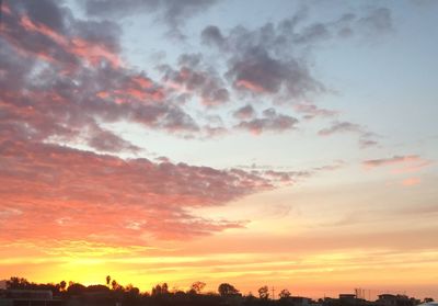 Low angle view of dramatic sky during sunset