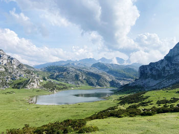 Scenic view of lake and mountains against sky