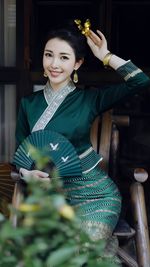 Portrait of smiling young woman standing in gym