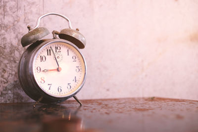 Close-up of clock on table