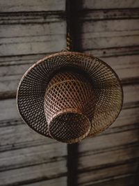 Close-up of lighting equipment hanging on wood