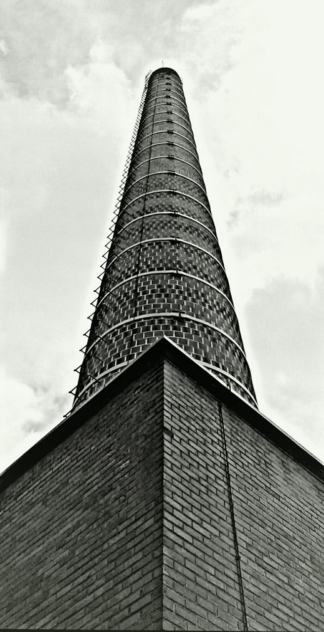 low angle view, architecture, built structure, building exterior, sky, tall - high, tower, cloud - sky, modern, cloud, office building, tall, skyscraper, cloudy, city, day, building, architectural feature, outdoors, directly below